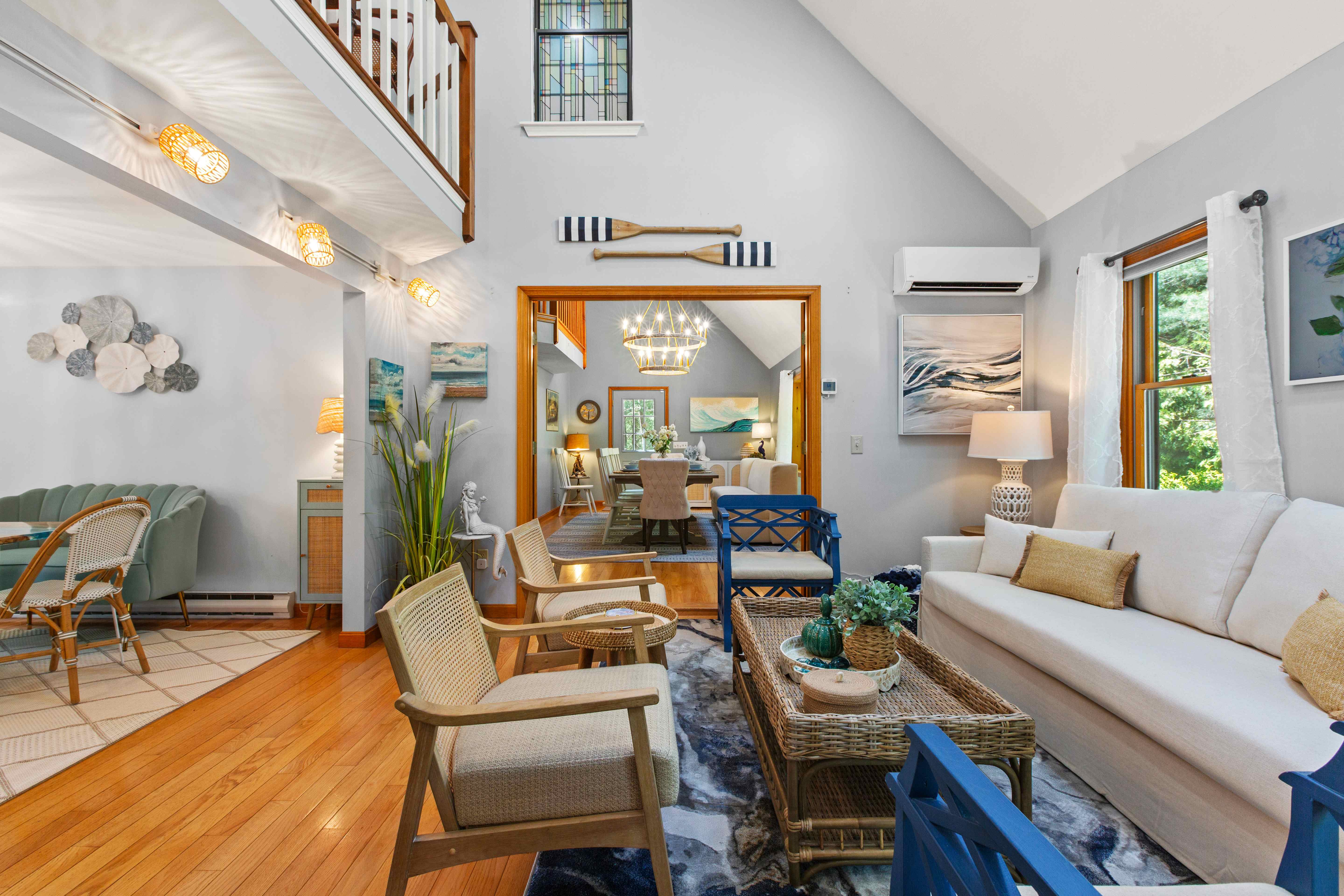 A sunlit, elegantly styled coastal living room